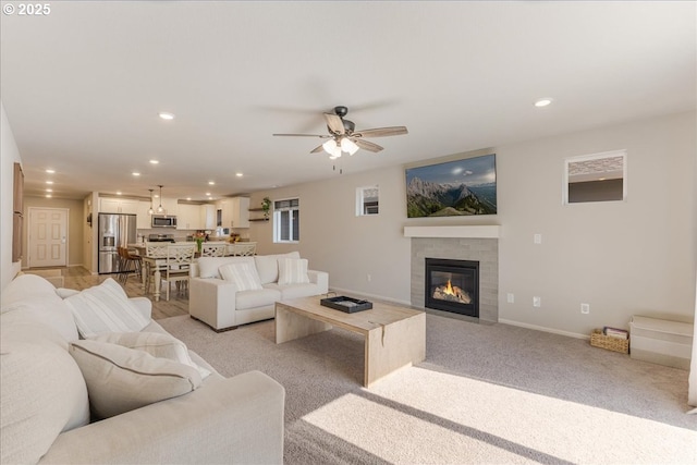 456 Cornwell St, Woodburn, OR 97071 - living room featuring a fireplace with flush hearth, light carpet, recessed lighting, and a ceiling fan