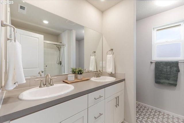 456 Cornwell St, Woodburn, OR 97071 - bathroom featuring tile patterned floors, double vanity, and a shower with shower door