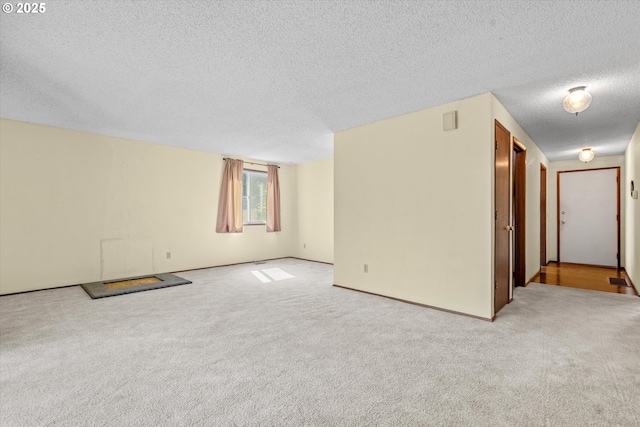 110 NE Village Squire Ave Unit 12, Gresham, OR 97030 - spare room featuring a textured ceiling and light colored carpet