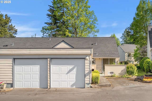110 NE Village Squire Ave Unit 12, Gresham, OR 97030 - view of front facade with a shingled roof, a gate, a garage, and fence