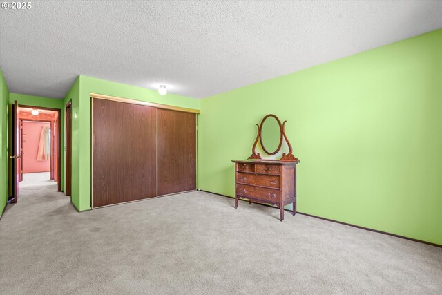 110 NE Village Squire Ave Unit 12, Gresham, OR 97030 - carpeted bedroom with a closet and a textured ceiling