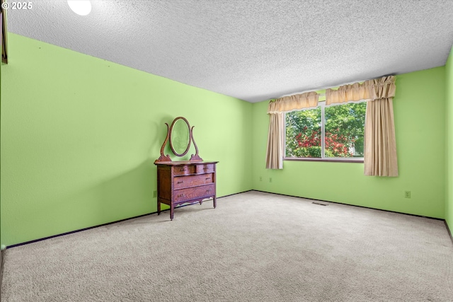 110 NE Village Squire Ave Unit 12, Gresham, OR 97030 - empty room featuring carpet, a textured ceiling, and baseboards