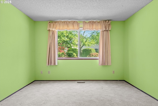 110 NE Village Squire Ave Unit 12, Gresham, OR 97030 - unfurnished room featuring carpet, a textured ceiling, and baseboards