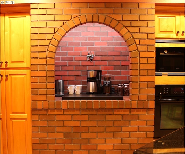 kitchen featuring dobule oven black