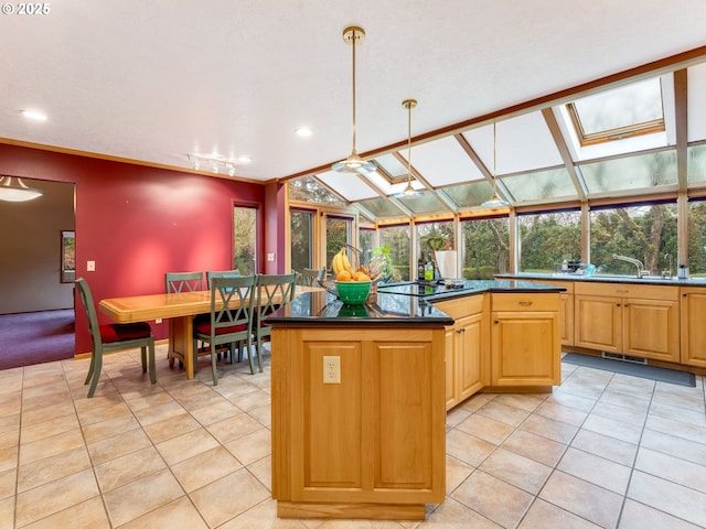 kitchen with dark countertops, light tile patterned flooring, hanging light fixtures, and a center island