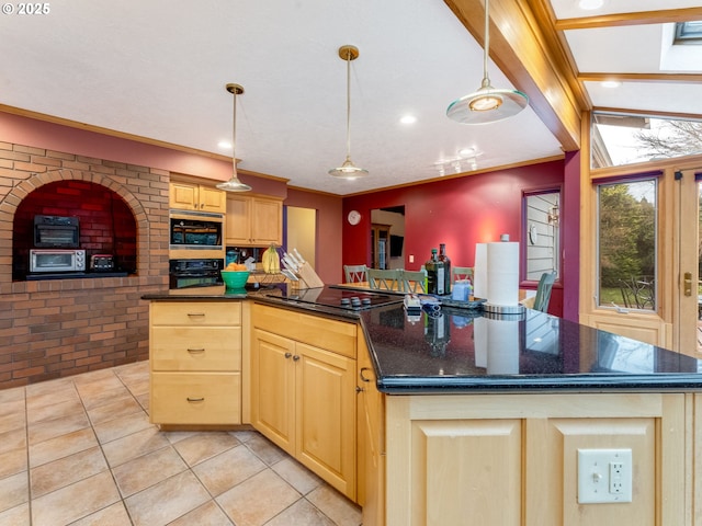 kitchen with hanging light fixtures, black appliances, light brown cabinets, and a kitchen island