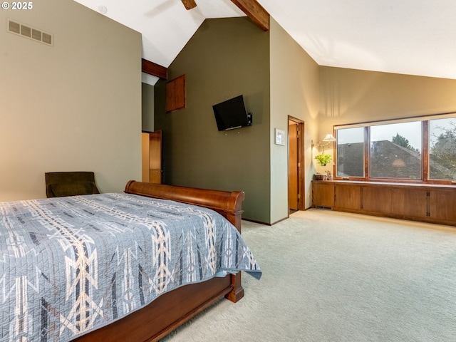 bedroom featuring light colored carpet, vaulted ceiling, and ceiling fan