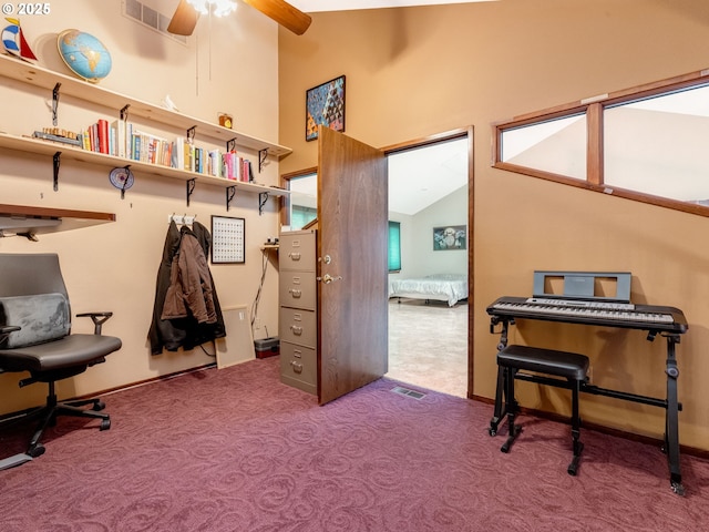 miscellaneous room featuring ceiling fan, vaulted ceiling, and carpet flooring