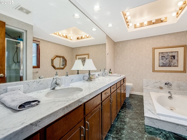 full bath with a garden tub, a tray ceiling, visible vents, and a sink