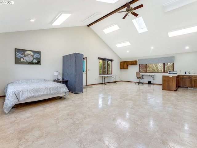 bedroom with a skylight, baseboards, beamed ceiling, high vaulted ceiling, and a sink