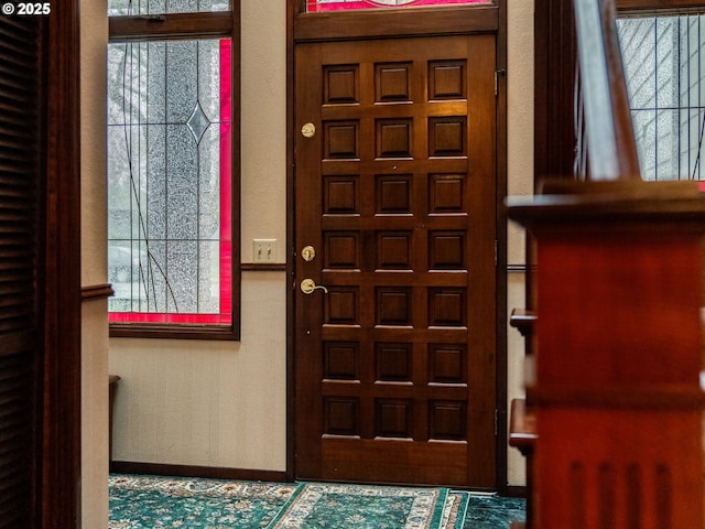 entrance foyer featuring baseboards