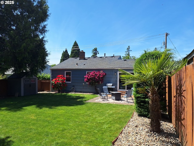 4777 Exeter St, West Linn, OR 97068 - rear view of house featuring a patio, a chimney, and roof with shingles