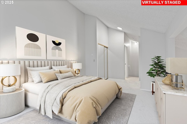 bedroom with light carpet, baseboards, a textured ceiling, and recessed lighting