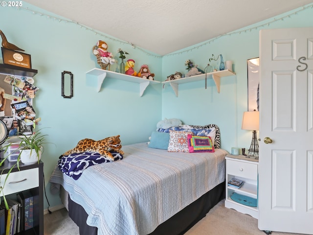 bedroom with light colored carpet