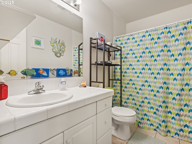 bathroom with a shower with curtain, toilet, visible vents, tile patterned flooring, and vanity