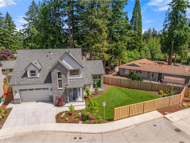 5826 SW Grayson Ter, Beaverton, OR 97078 - view of front of property featuring stone siding, concrete driveway, a shingled roof, a garage, and view of wooded area