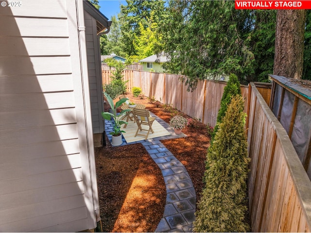 5826 SW Grayson Ter, Beaverton, OR 97078 - fenced backyard featuring a patio area