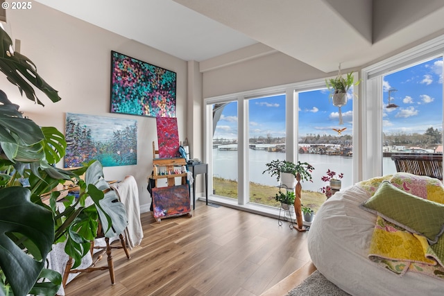 interior space featuring a water view and hardwood / wood-style flooring