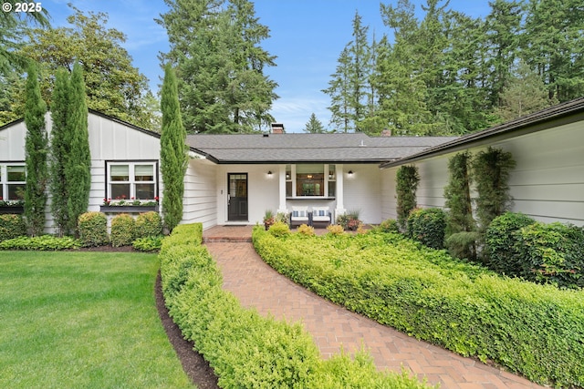 475 Iron Mountain Blvd, Lake Oswego, OR 97034 - view of front facade featuring a front yard, a porch, a chimney, and board and batten siding