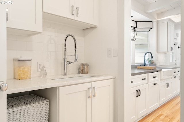 475 Iron Mountain Blvd, Lake Oswego, OR 97034 - bar featuring a sink, decorative backsplash, light wood-style floors, and beam ceiling