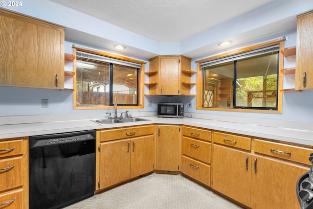 kitchen with open shelves, dishwasher, a sink, stainless steel microwave, and light countertops