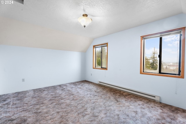 bonus room with baseboard heating, carpet floors, lofted ceiling, and a textured ceiling