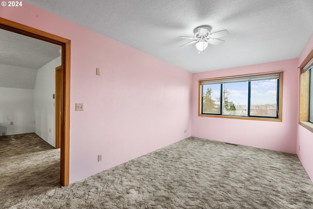 spare room with carpet floors and ceiling fan
