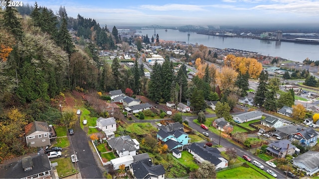 aerial view of property's location with a notable bridge, a large body of water, and nearby suburban area