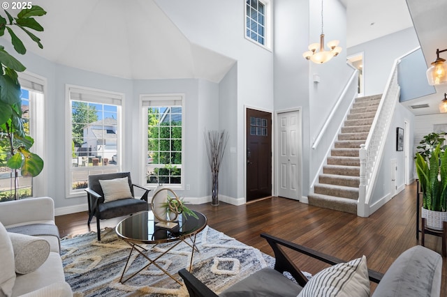 5346 NW Wickiup Way, Portland, OR 97229 - living room with a high ceiling, stairway, wood finished floors, and a chandelier