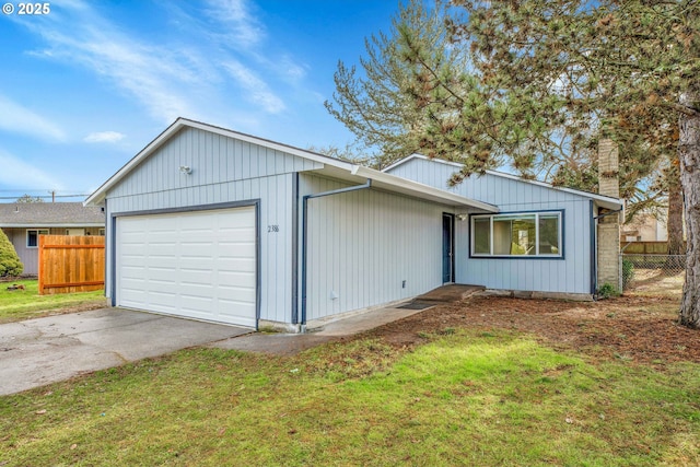 single story home with a garage and a front yard