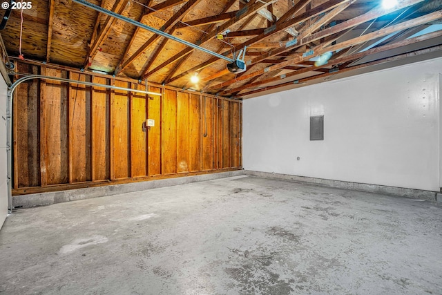 garage featuring a garage door opener and electric panel