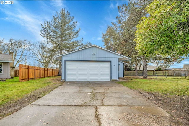 garage featuring a lawn