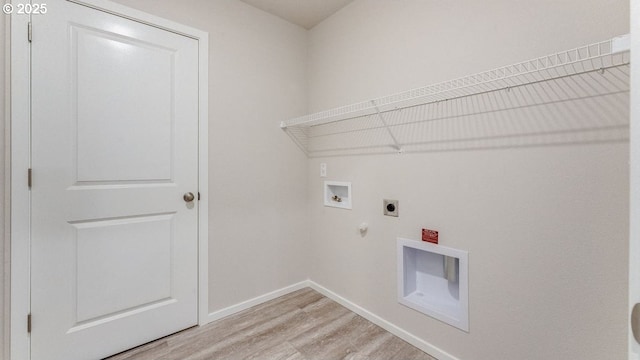 laundry area featuring gas dryer hookup, washer hookup, hookup for an electric dryer, and light hardwood / wood-style floors