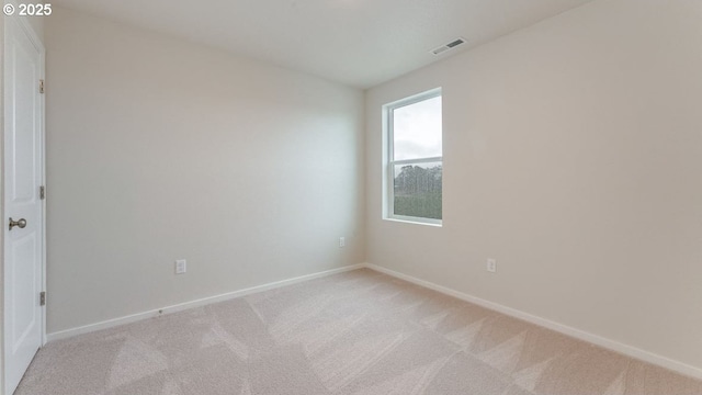 unfurnished room with light colored carpet