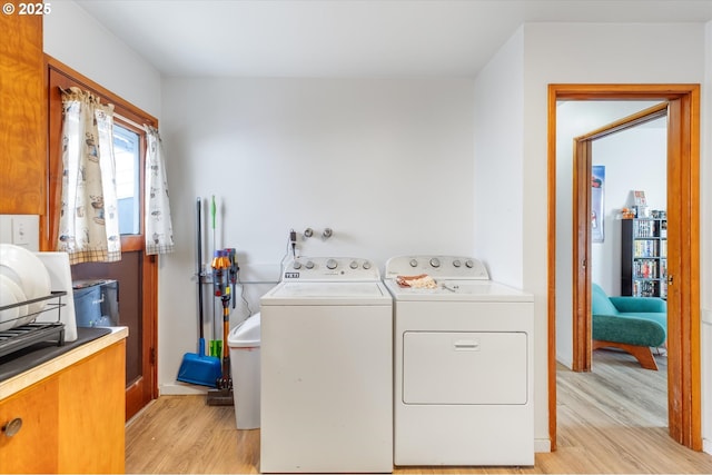 405 Redpath St, Kelso, WA 98626 - laundry room with light wood-style floors and washing machine and dryer
