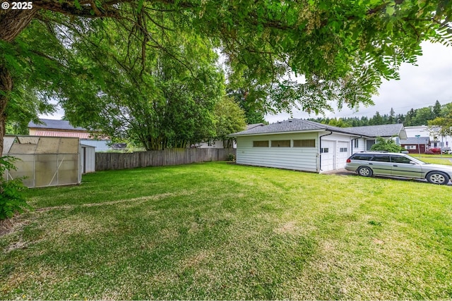 405 Redpath St, Kelso, WA 98626 - view of yard featuring an attached garage, a greenhouse, and an outdoor structure