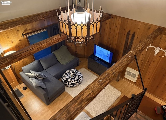 living room featuring wood walls