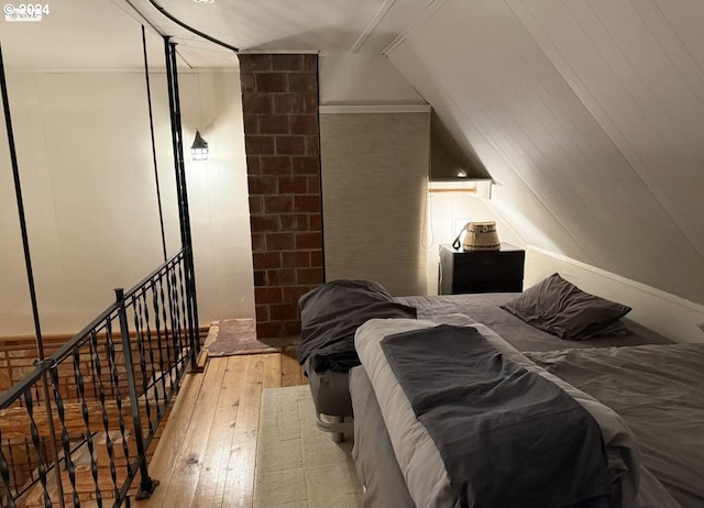 bedroom with wood-type flooring