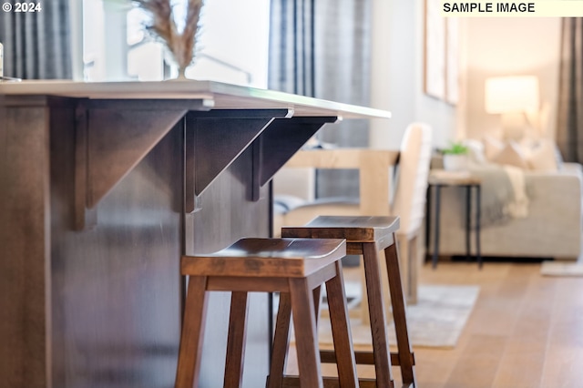 interior details with light hardwood / wood-style flooring