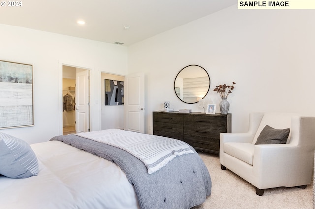bedroom featuring vaulted ceiling, recessed lighting, visible vents, and light colored carpet
