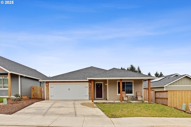 ranch-style home with an attached garage, covered porch, fence, and concrete driveway