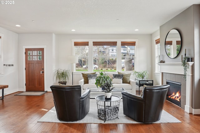 29176 SW Costa Cir E, Wilsonville, OR 97070 - living area with a fireplace, hardwood / wood-style flooring, recessed lighting, and baseboards