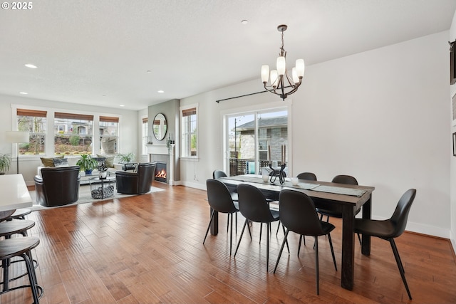 29176 SW Costa Cir E, Wilsonville, OR 97070 - dining room with a chandelier, recessed lighting, plenty of natural light, baseboards, and light wood-type flooring