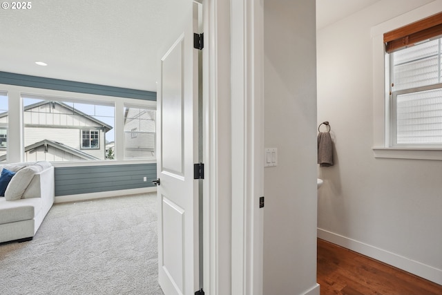 29176 SW Costa Cir E, Wilsonville, OR 97070 - hall with baseboards and wood finished floors