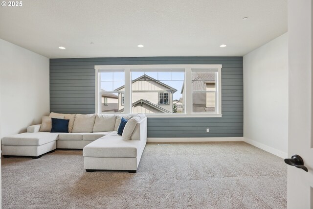 29176 SW Costa Cir E, Wilsonville, OR 97070 - living area with carpet floors, baseboards, and recessed lighting