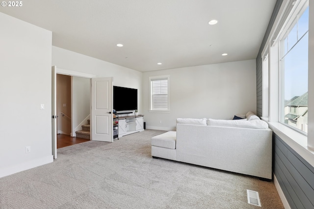 29176 SW Costa Cir E, Wilsonville, OR 97070 - living room with carpet, recessed lighting, stairway, and baseboards