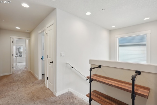 29176 SW Costa Cir E, Wilsonville, OR 97070 - corridor featuring light colored carpet, recessed lighting, baseboards, and an upstairs landing