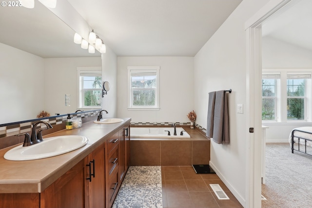 29176 SW Costa Cir E, Wilsonville, OR 97070 - bathroom featuring a garden tub, baseboards, double vanity, and tile patterned floors