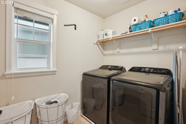 29176 SW Costa Cir E, Wilsonville, OR 97070 - clothes washing area with washer and dryer and tile patterned flooring
