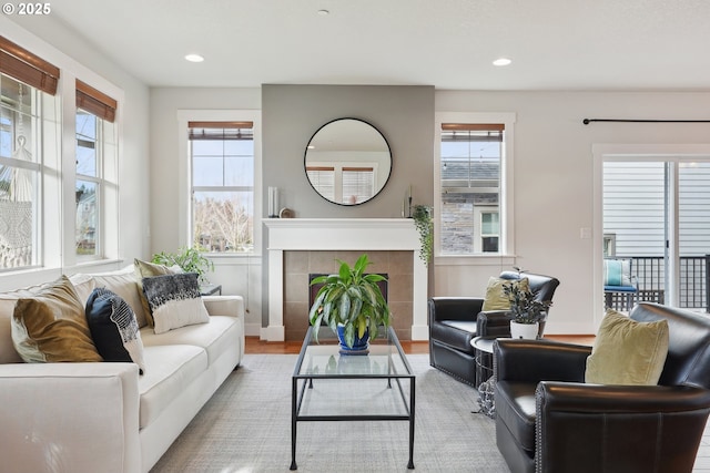 29176 SW Costa Cir E, Wilsonville, OR 97070 - living area featuring recessed lighting, a fireplace, wood finished floors, and baseboards
